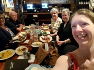From left to right, Elaine Samaolytz, Darrel & Bernice Baltzer, Marcia Van Gorden and Caitlin Fortuna (smiling for a selfie) at dinner.